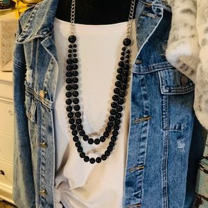 Black beaded necklace with sliver chain.